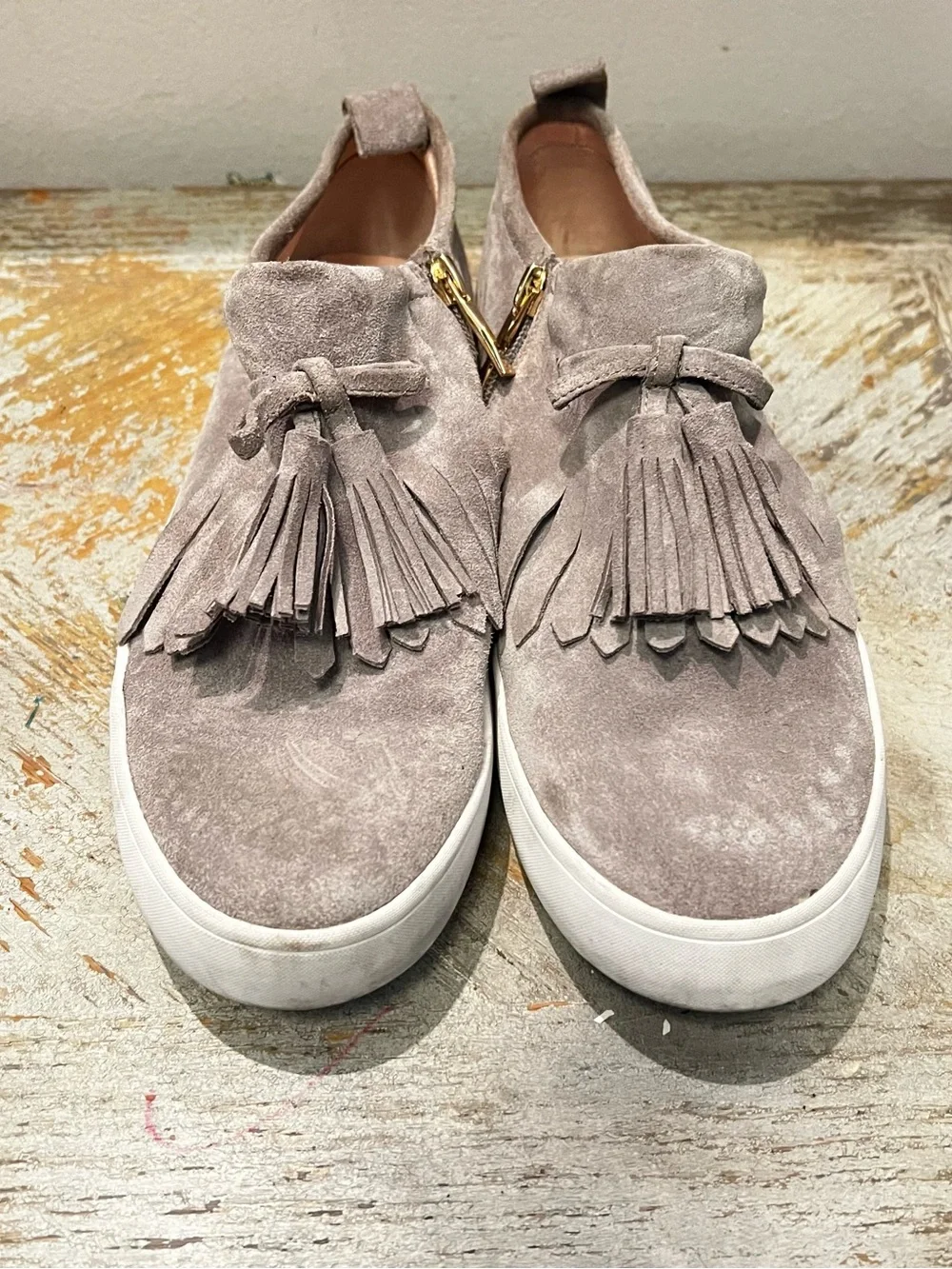 Kate Spade Taupe Gray Suede Fringed Tassel Slip-On Sneakers Gold Tone Side Zip
